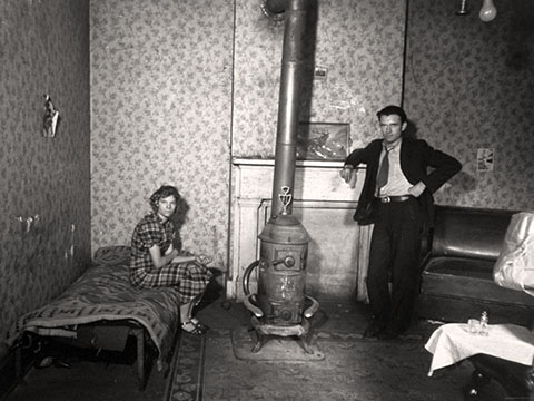 A young couple by the stove in their tenement, Hamilton County, Ohio. 1936